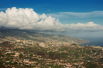 Huge cloud hung over the town on a mountain