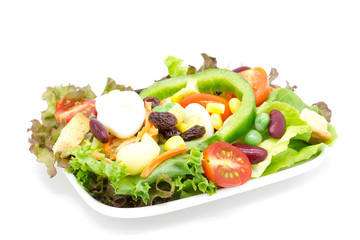 Fresh vegetable salad isolated on white