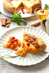 Homemade pumpkin pie on table