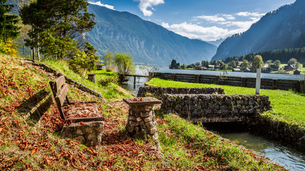 Stone bench at the mountain river