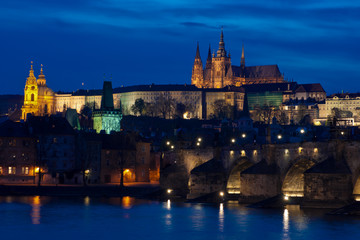 Castle and Charles Bridge by night in Prague, Czech Republic.