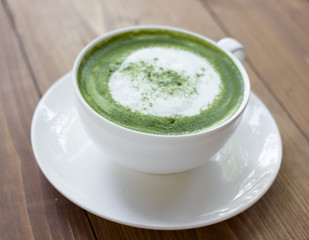 Matcha green tea latte beverage in glass.