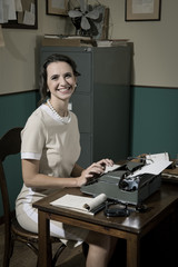 Young vintage secretary at work