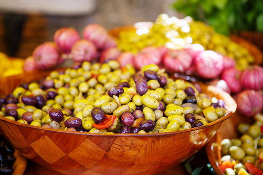 Marinated garlic and olives on provencal street market in Proven