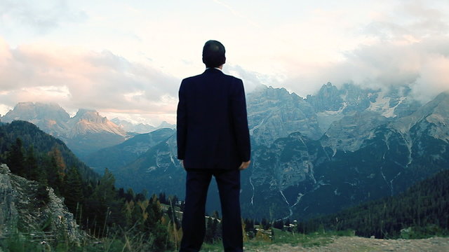 Man feeling freedom in the mountains