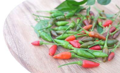 chili red and green on wooden , white background