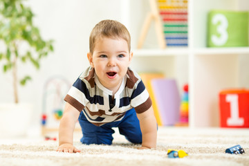 child boy playing with toys indoor