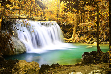 Fototapeta na wymiar Beautiful waterfall in autumn forest