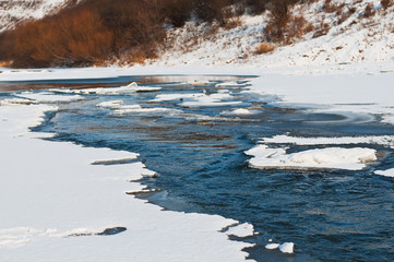 River  with snow along the banks.
