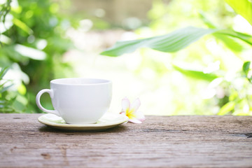 coffee in white cup on wooden table