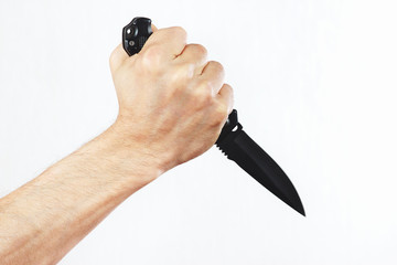 Obraz premium Hand with a combat knife on a white background