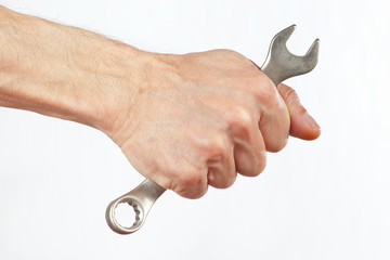 Hand of serviceman with a wrench on a white background