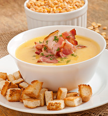 Cream soup of peas with fried bacon and croutons