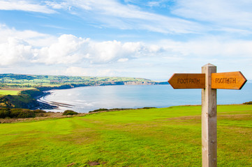 Footpath direction sign in English countryside