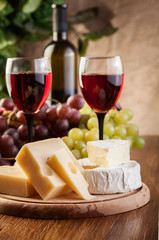 Cheese with a bottle and glasses of red wine