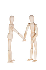Two wooden dummies represent friendly handshake or a greeting