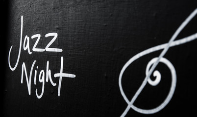 Fototapeta na wymiar Jazz Night advertisement sign on blackboard