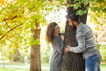 smiling couple in love in autumn in park