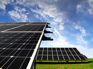 Solar energy panels against sunset sky