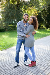 smiling couple in love in autumn in park