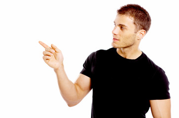 Handsome young man pointing to the side