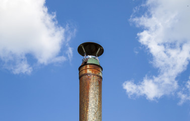 Metal pipe against the sky.