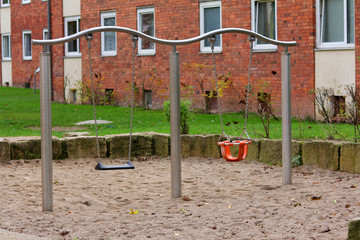 Fototapeta na wymiar Empty swing at the playground