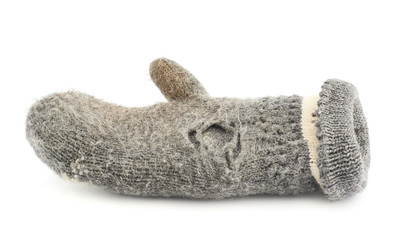 Old gray frayed mitten isolated
