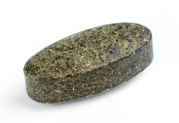 Wheatgrass spirulina superfood tablet isolated on white