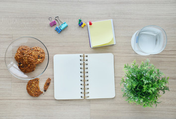 blank paper and office tools on the wood table - Top view