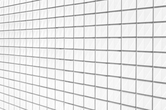 The modern white concrete tile wall background