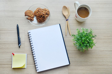 Blank paper, coffee break and office tools on the wood table - T