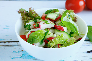 Fresh salad in a white bowl