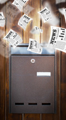 Post box with daily newspapers flying