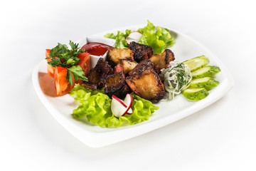 Barbecue with vegetables and greens