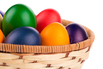 Colorful Easter eggs in basket.