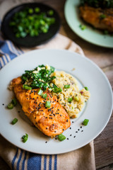 Salmon steak with mashed potatoes and greens