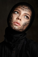 Young beautiful woman with faceart - obrazy, fototapety, plakaty