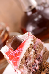 Cake with chocolate heart and glass carafe