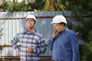 Two engineers taking a smoke break