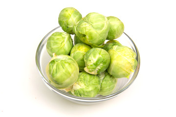 Brussels sprouts on bowl on white background