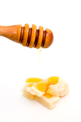 Spoon of honey with cheese on white background