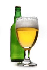 Glass of real beer isolated on white background