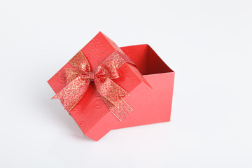 An empty red gift box with the lid off