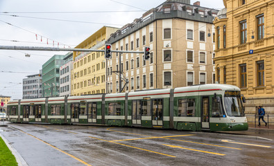 Fototapeta premium Modern tram on a street of Augsburg - Germany, Bavaria