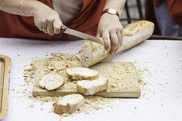 Cutting bread in a shop