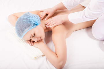 Fototapeta na wymiar Portrait of young woman during massage procedure