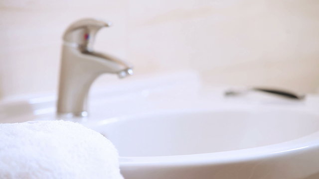 Young female Hand washing with dolly-in and dolly-out technique