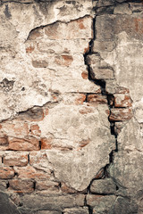 Old damaged wall with a big crack texture