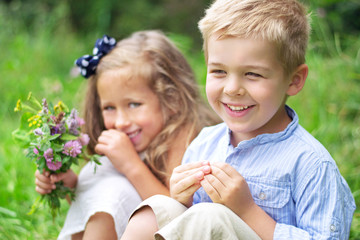 Portrait of cute children with flowers